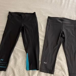 2 pairs Under Armour compression leggings. Grey pair and black/teal pair. Size M